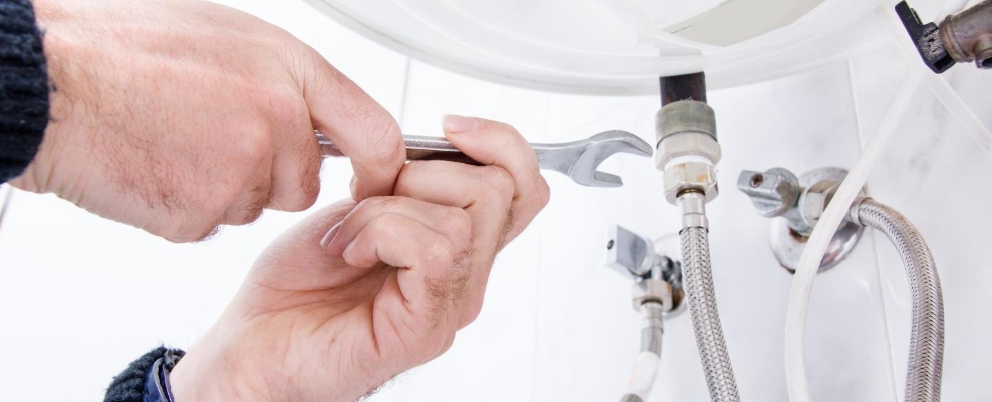 plumber repairing bathroom sink ararat va