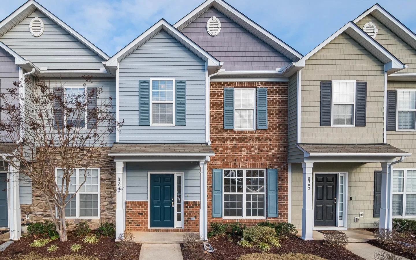 multiple houses attached to each other on the sides